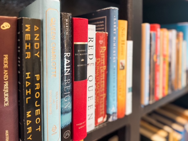 A close view of books on the real shelves at Lonesome Dove Library